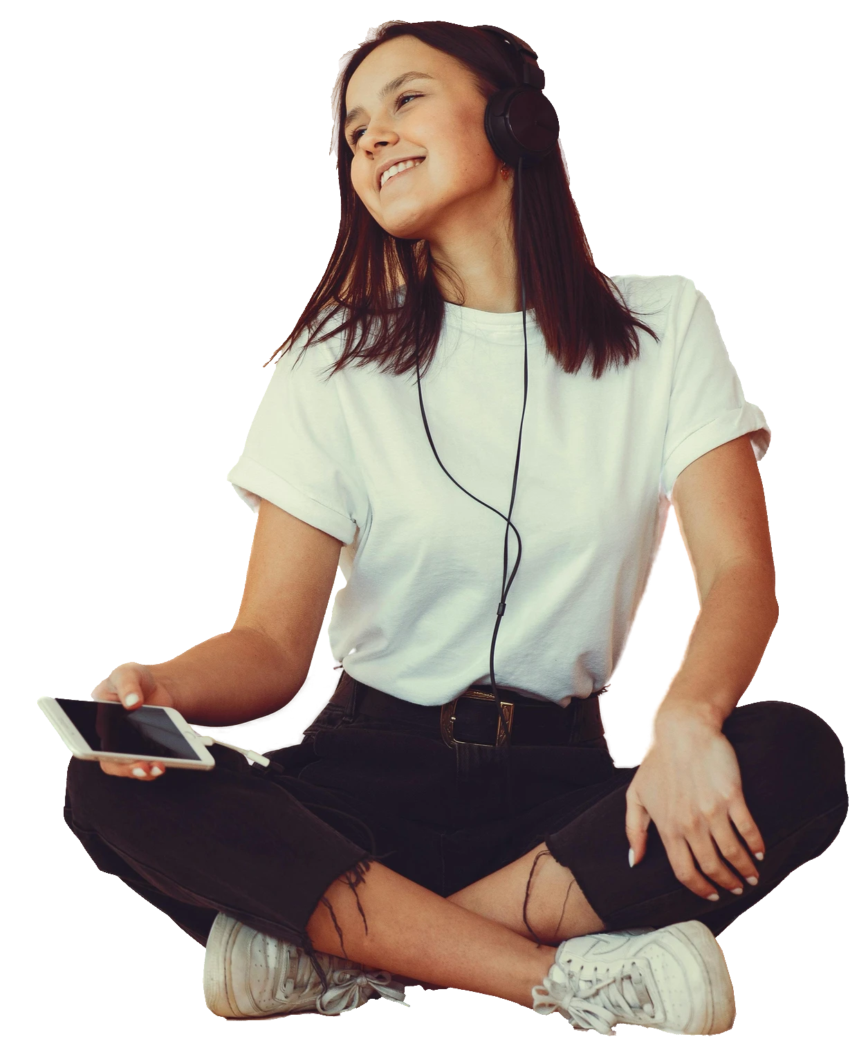 A person in headphones listening to a book on their phone